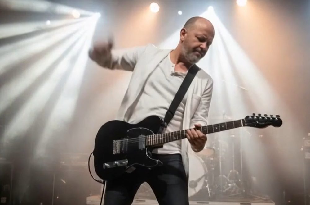 Peter Sanford performing live on guitar